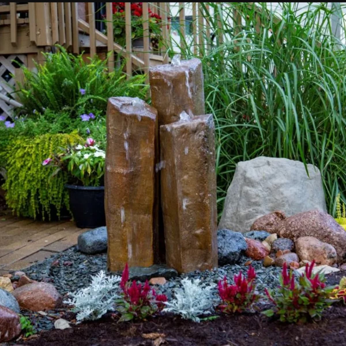 Garden landscape with stone water feature.- Faux Basalt Column Set of 3