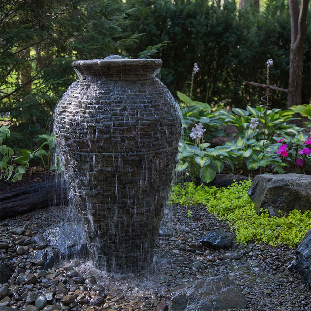 Garden fountain with water flowing over stone vase. - Stacked Slate Urn Fountain Kit – 45″ H (114 cm)