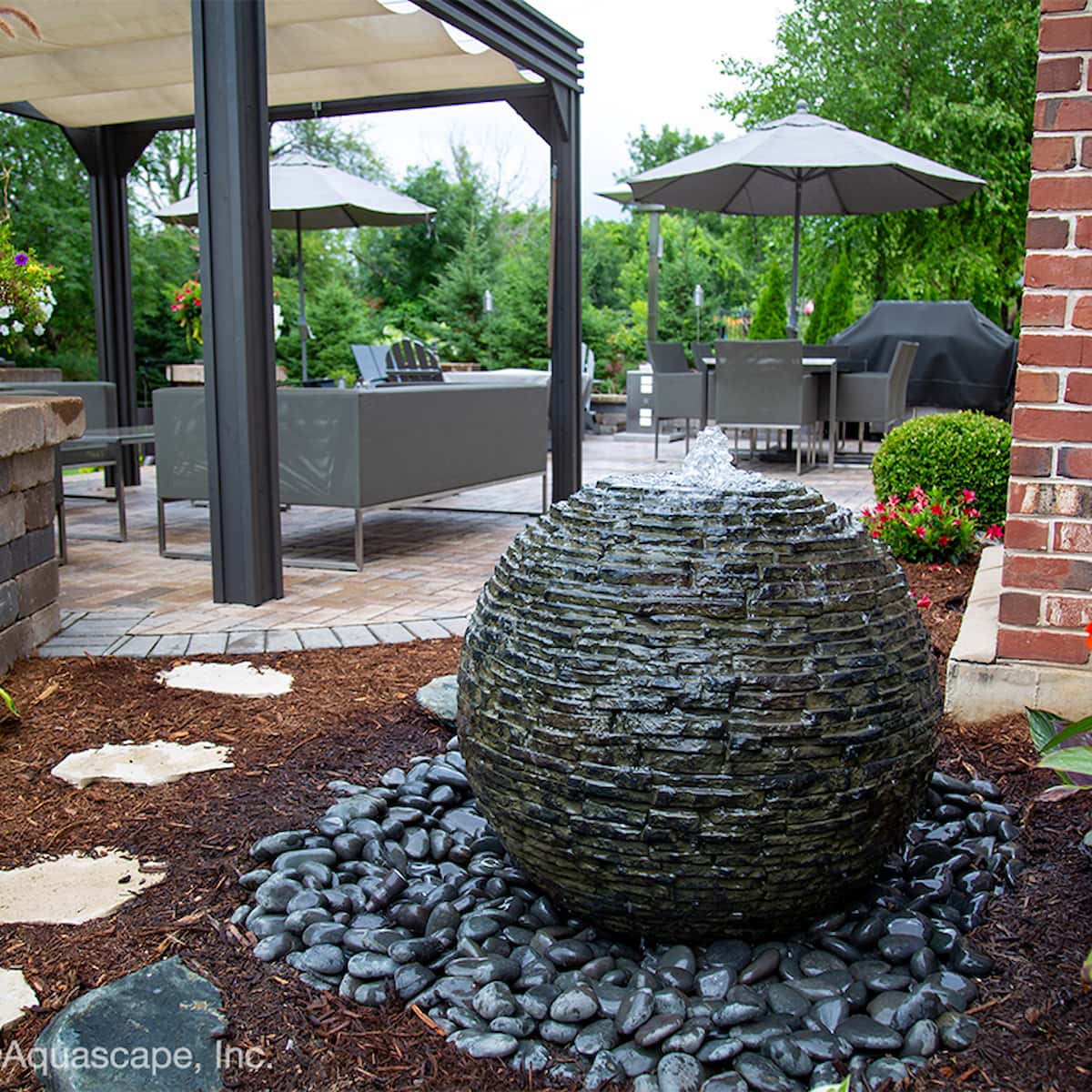 Modern patio with stone ball fountain feature. - Stacked Slate Sphere Fountain Kit – 32″ Dia (81 cm)