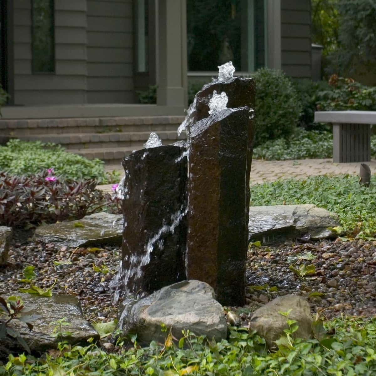 Stone water feature in landscaped garden. - Natural Mongolian Basalt Columns Set Of 3 Fountain Kit