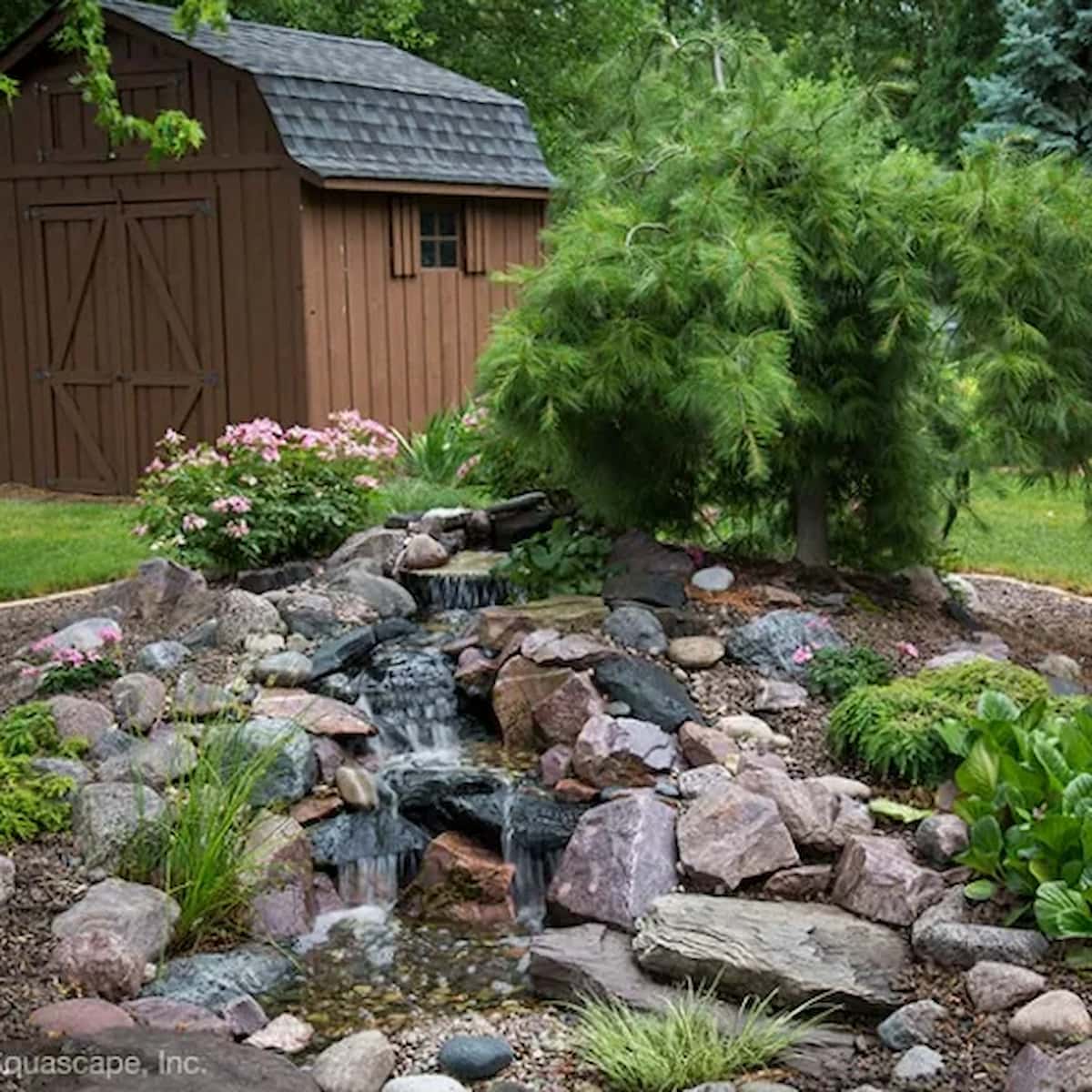 Garden waterfall near rustic wooden shed - Backyard Waterfall Landscape Fountain Kit