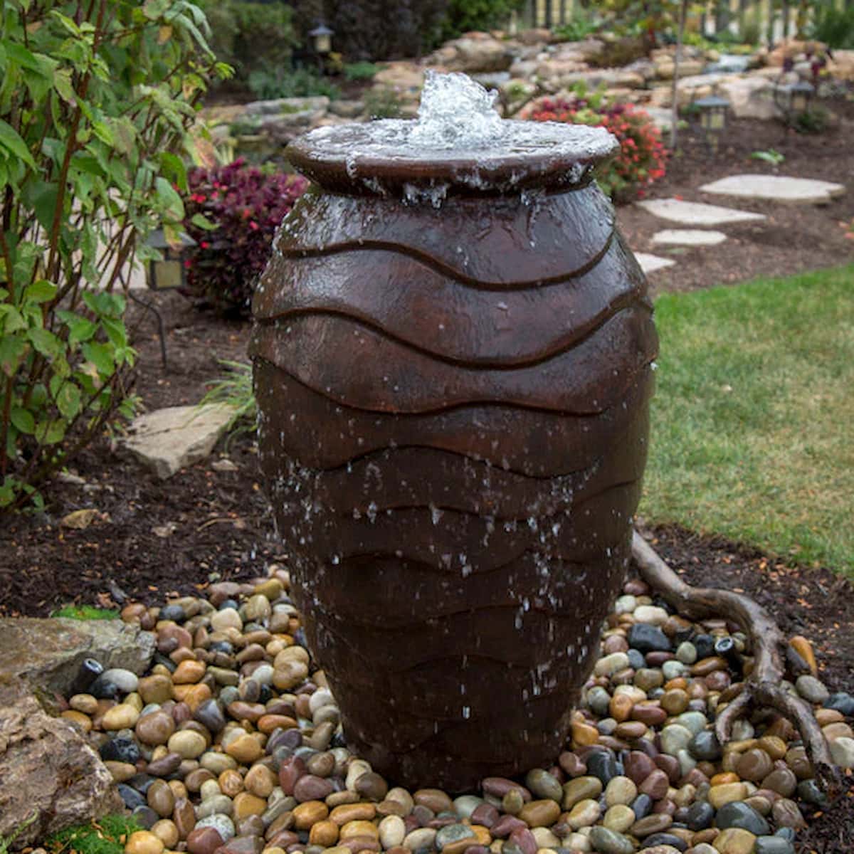 Water feature with vase and garden stones. - Scalloped Urn Fountain Kit – 45″ H (114 cm)