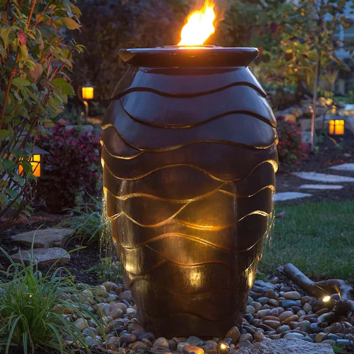 Garden fire pit with glowing lights at night. - Scalloped Urn Fountain Kit –Scalloped Urn Fountain Kit – 45″ H (114 cm)