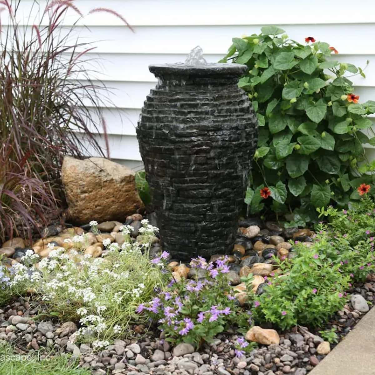 Garden fountain with rocks and colorful flowers - Stacked Slate Urn Fountain Kit – 24″ H (61 cm)